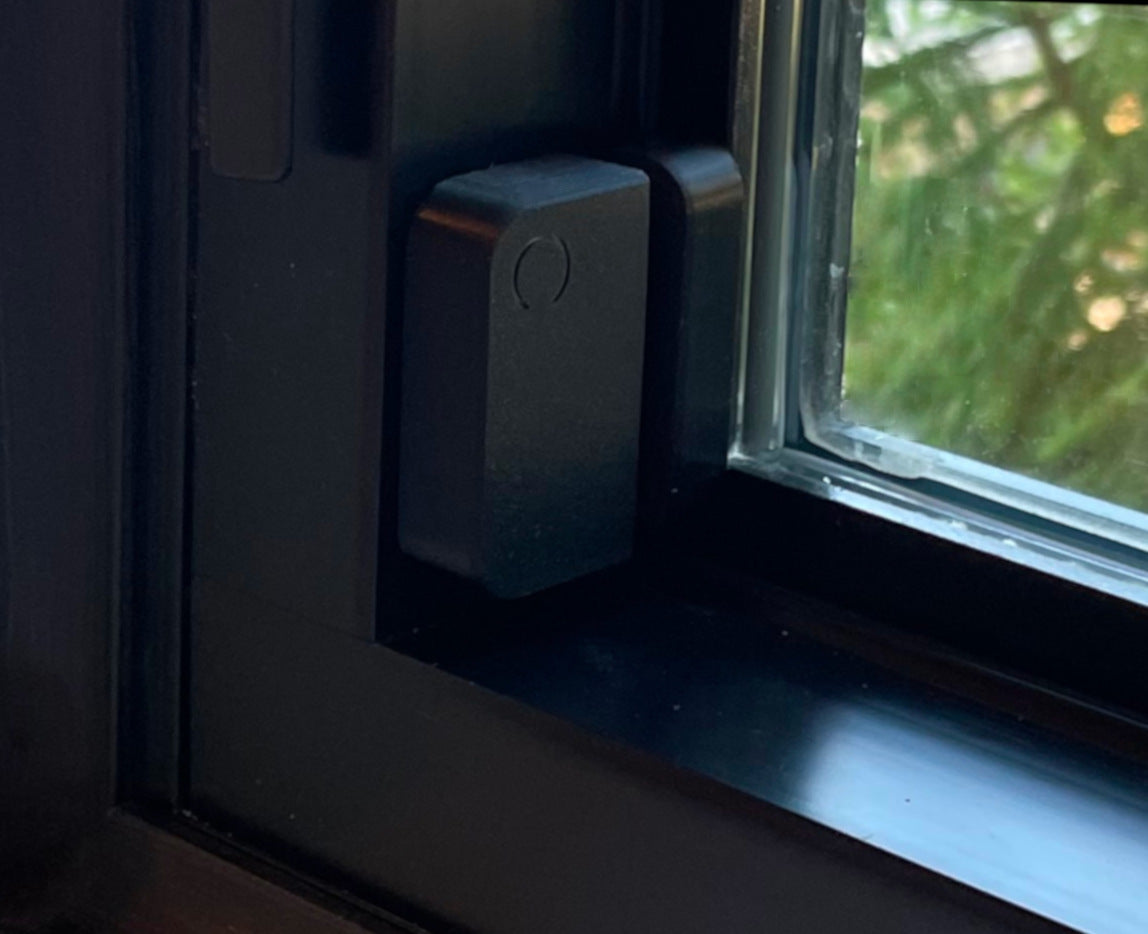Ring sensor with ZPitome black cover to blend into modern black window